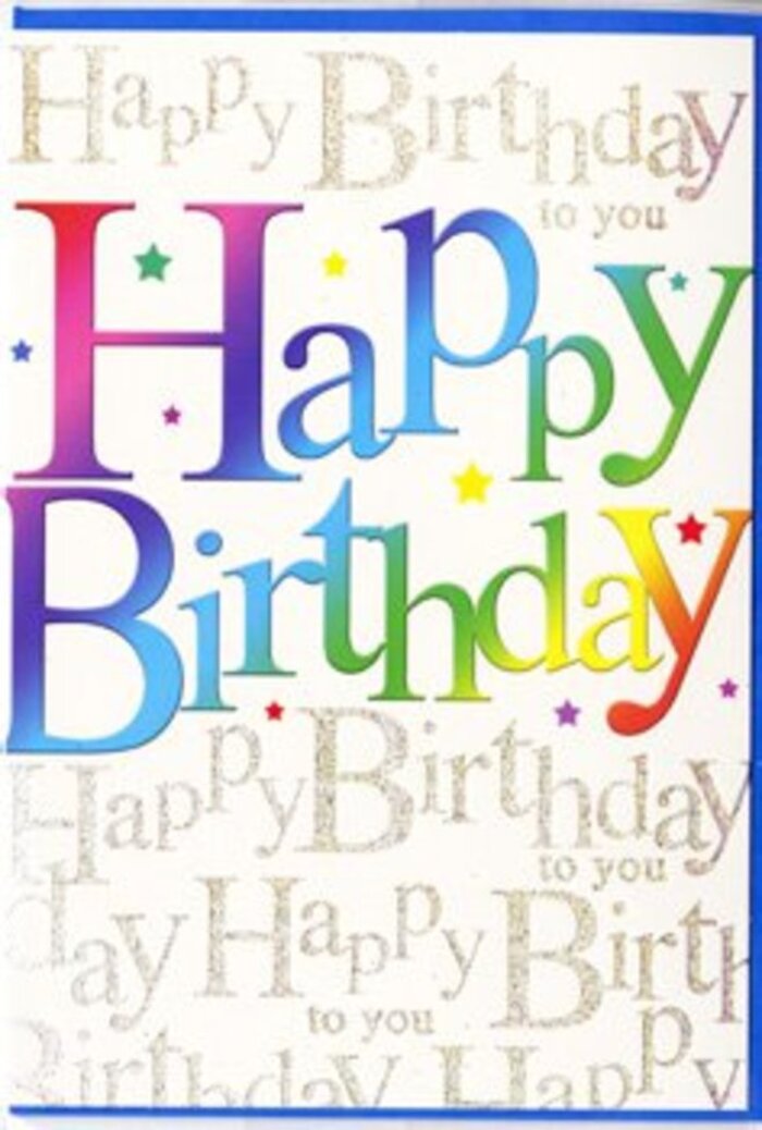 In the image, a birthday card stands against a neutral backdrop, its front artwork alive with colour and optimism that suits the easygoing feel of North Ockendon's leafy lanes. The most striking element is the phrase "Happy Birthday," printed across the centre in broad, curving letters. These letters are cloaked in a fluid rainbow gradient that drifts from rich red and warm raspberry through blush pink and plum into deep blue, indigo, and teal before brightening into grassy green, chartreuse, and golden yellow. The gradient is smooth and velvety, with no harsh edges, evoking the soft blending of tones you might see in a well-composed floral arrangement. The design suggests a slight gloss or satin finish, as though the colours might shimmer faintly if you tilted the card under a lamp, much like sunlight glancing off petals in a North Ockendon garden. Behind this joyful greeting, the background is fully covered in slender, handwritten-style script. The phrase "Happy Birthday to you" repeats line after line, curling gently across the card in metallic gold ink that glows subtly rather than glaring. This golden writing forms an intricate tapestry, yet it remains understated enough that the rainbow headline remains centre stage. Sprinkled throughout the gold script are minuscule specks and dot-like stars in matching rainbow shades, giving the impression of confetti or distant fireworks against a twilight sky. Together, the bold central text and the ornate yet gentle background create a sense of both fun and refinement. It feels like exactly the sort of card you might select to go with a hand-tied bouquet ordered for delivery to a quiet birthday supper in North Ockendon, conveying not just congratulations but a real sense of occasion.